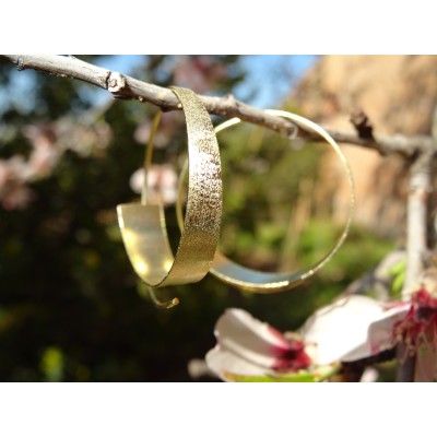 Boucles d'oreilles dorées...